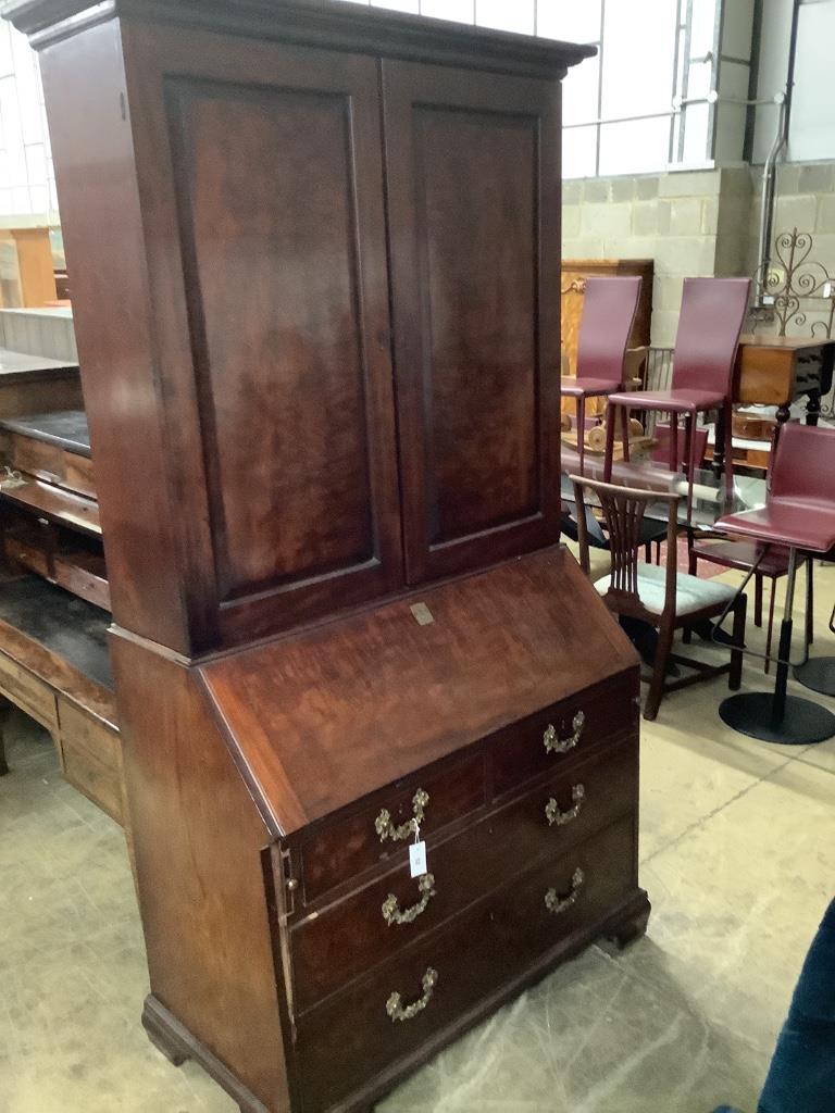 A George III mahogany bureau cabinet, width 114cm, depth 58cm, height 222cm